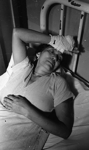 Woman in hospital bed, Nicaragua, 1979