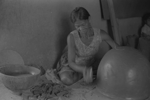 A woman making pottery, La Chamba, Colombia, 1975