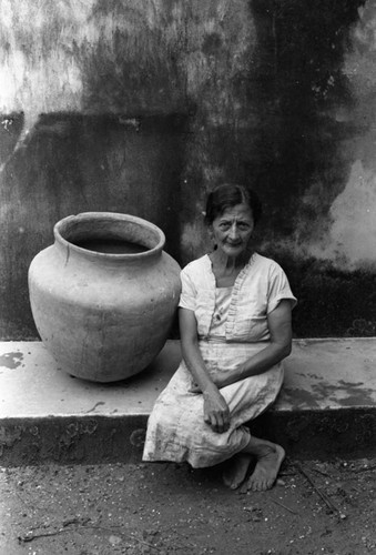 Woman and a clay jug, La Chamba, Colombia, 1975