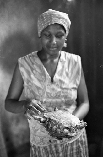 Anselma Salas cooking a turtle, San Basilio de Palenque, 1977