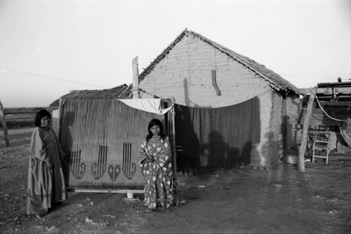 Wayuu women near large weaving, La Guajira, Colombia, 1976