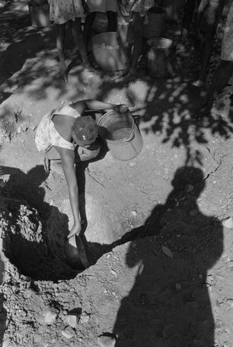 Girl collecting water at river, San Basilio de Palenque, ca. 1978