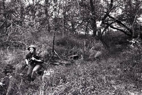 Survival school student holds a rifle, Liberal, 1982