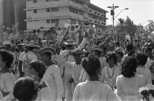 Dancers walking with a float, Barranquilla, Colombia, 1977