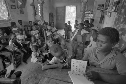 Teacher working with students in informal classroom, San Basilio de Palenque, ca. 1978