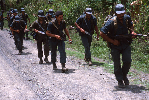 A group of Contras move along a country road, Nicaragua, 1983