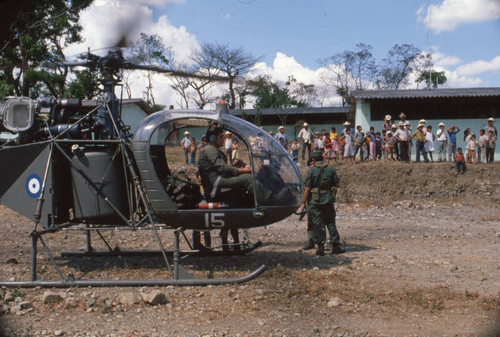 Soldier sitting in a helicopter, Chalatenango, El Salvador, 1981