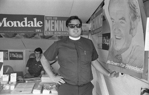 Clergyman and campaign posters