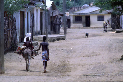 Children riding a mule, San Basilio de Palenque, 1976