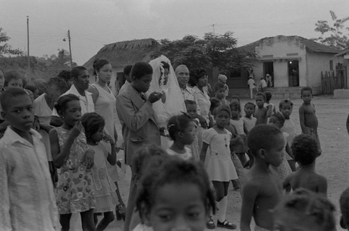 Wedding couple walking in the street, San Basilio de Palenque, 1976