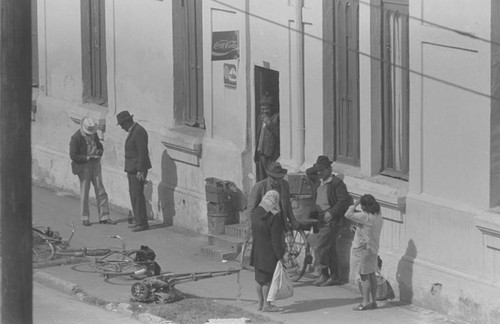 A group of men and women socializing, Bogotá, Colombia, 1976