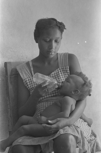 Woman feeding a baby, San Basilio de Palenque, 1978