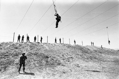 Salvadoran soldiers receiving parachute training at military base, Ilopengo, 1983