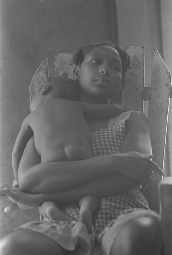 Woman holding a baby, San Basilio de Palenque, 1976