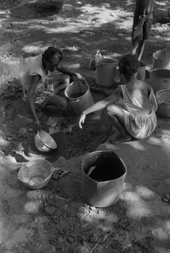 Girl collecting water at river, San Basilio de Palenque, ca. 1978