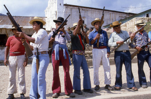 Mayan men learning how to handle shotguns, Chajul, 1982