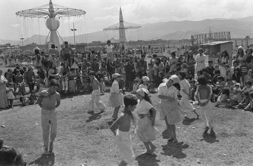 Children dancing at Tunjuelito's Christmas festivities, Tunjuelito, Colombia, 1977