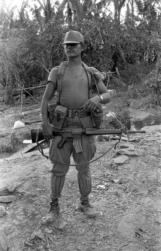 Army soldier stands on guard, Perquín, 1983