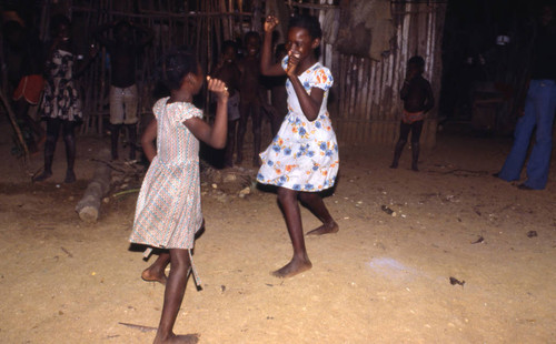 Girls boxing outdoors, San Basilio de Palenque, 1976