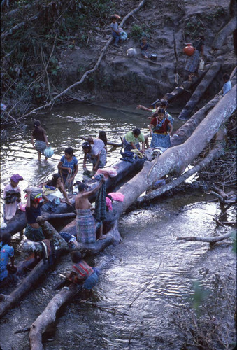 Guatemalan refugees washing at a river, Puerto Rico, ca. 1983 — Calisphere