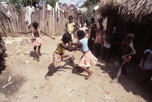 Girls boxing outdoors, San Basilio de Palenque, 1976