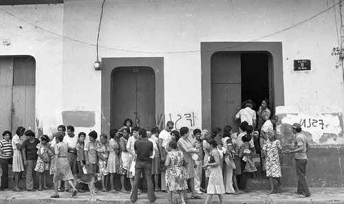 People line up outside of a building, Nicaragua, 1979