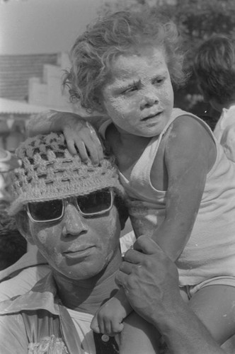 Man and child at carnival, Barranquilla, ca. 1978