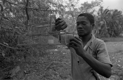 Young man preparing an animal trap, San Basilio de Palenque, 1977