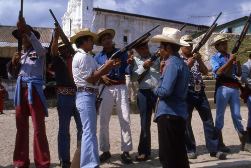 Mayan men holding shotguns, Chajul, 1982