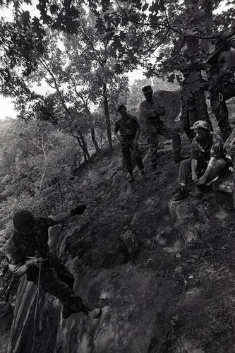 Claflin demonstrates rappelling, Liberal, 1982