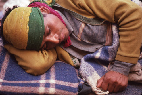 Guatemalan refugee laying on the ground, Santiago el Vértice, 1983