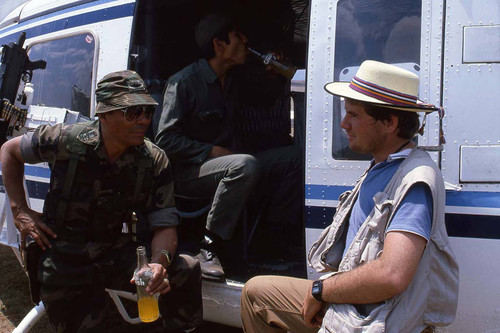 General Bendedicto Lucas Garcia drinking soda, Santa Cruz del Quiché, 1982