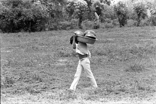 Transporting clay goods, La Chamba, Colombia, 1975