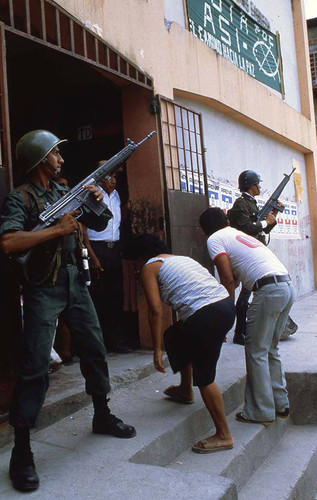 Soldiers guarding a polling place, San Salvador, 1983