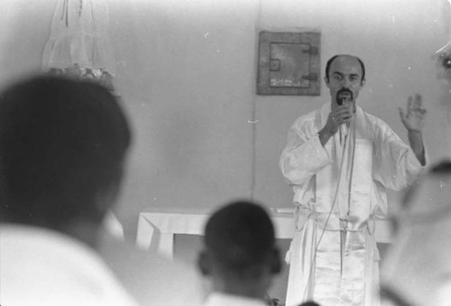 Priest celebrating a baptism, San Basilio de Palenque, 1975