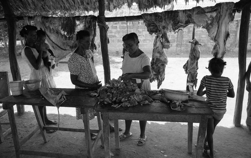 Women selling and buying meat, San Basilio de Palenque, 1976