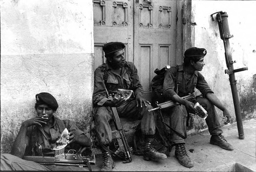 Three soldiers enjoy a break, El Salvador, ca. 1983