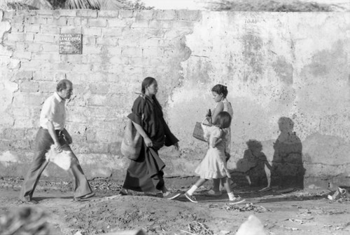 Residents walk near shop, La Guajira, Colombia, 1976