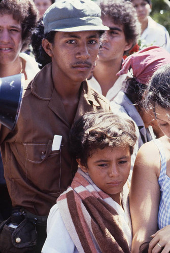 A young man and a boy mourning, Nicaragua, 1983