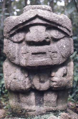 Stone statue, figure holding a snake, San Agustín, Colombia, 1975