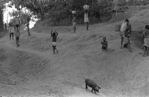 Children walking next to river, San Basilio de Palenque, 1976