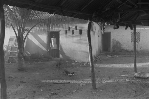 Woman standing at doorway, San Basilio de Palenque, ca. 1978