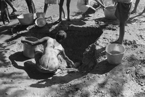 Girl collecting water at river, San Basilio de Palenque, ca. 1978