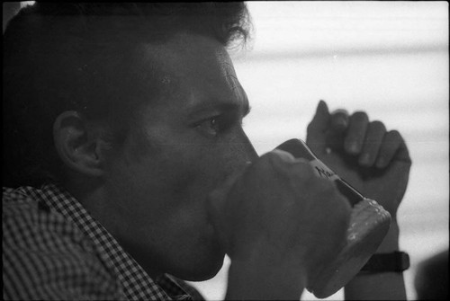 Side profile of Roberto D'Aubuisson drinking from a mug, San Salvador, 1982