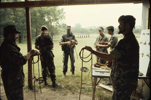 Survival school students tie rope, Liberal, 1982