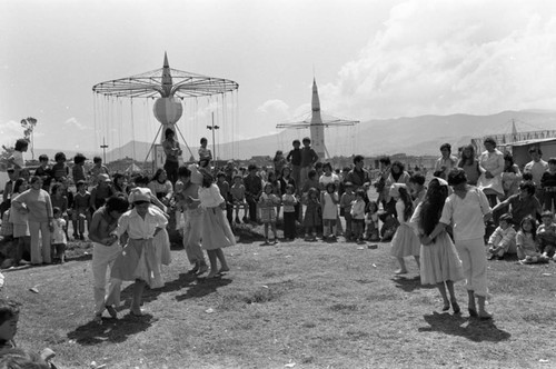 Children dancing at Tunjuelito's Christmas festivities, Tunjuelito, Colombia, 1977