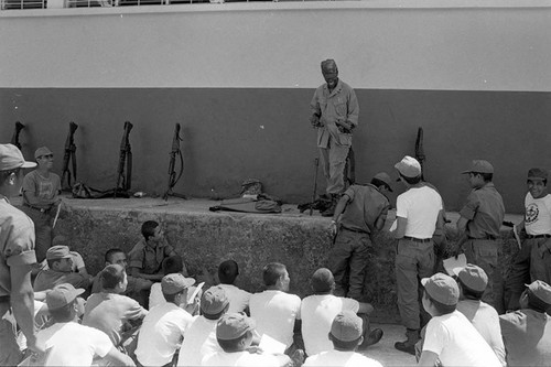 U.S. advisor training Salvadoran soldiers at military base, Ilopango, 1983