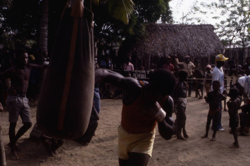 Boxer working out on a punching bag, San Basilio de Palenque, 1976