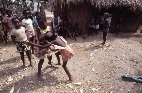 Girls boxing outdoors, San Basilio de Palenque, 1976