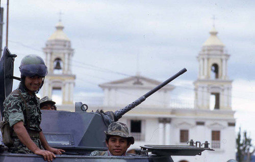 Three soldiers on patrol in an armored vehicle, Chimaltenango, 1982